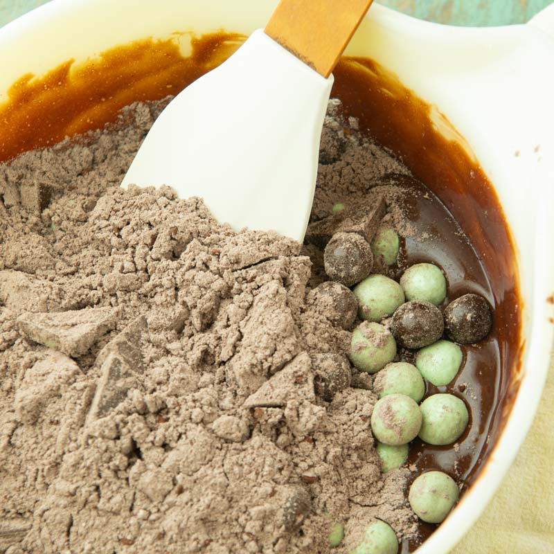 folding flour and mix ins into brownie batter