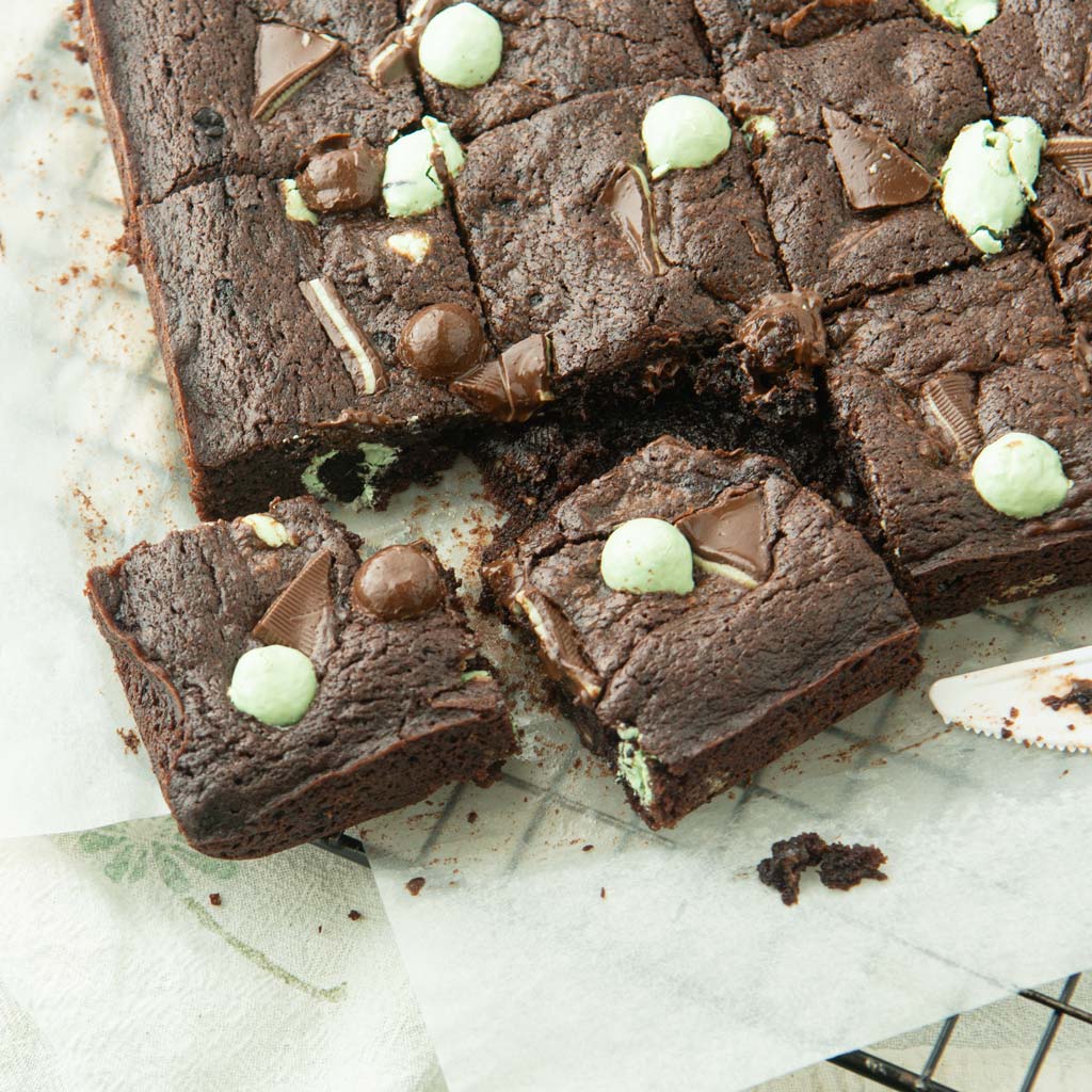 cut up mint brownies on parchment
