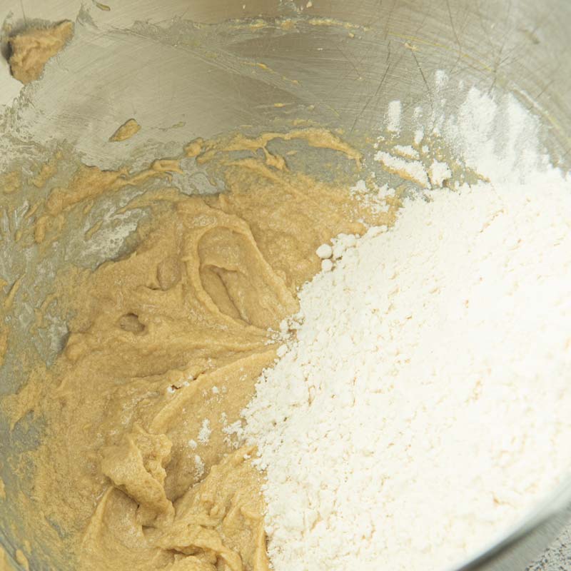 adding flour to butter mixture
