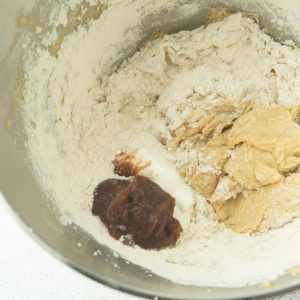 adding apple butter and sour cream to cake batter