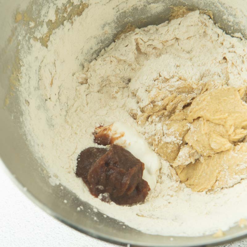adding apple butter and sour cream to cake batter