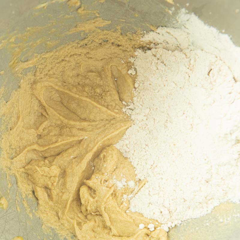 adding flour to batter