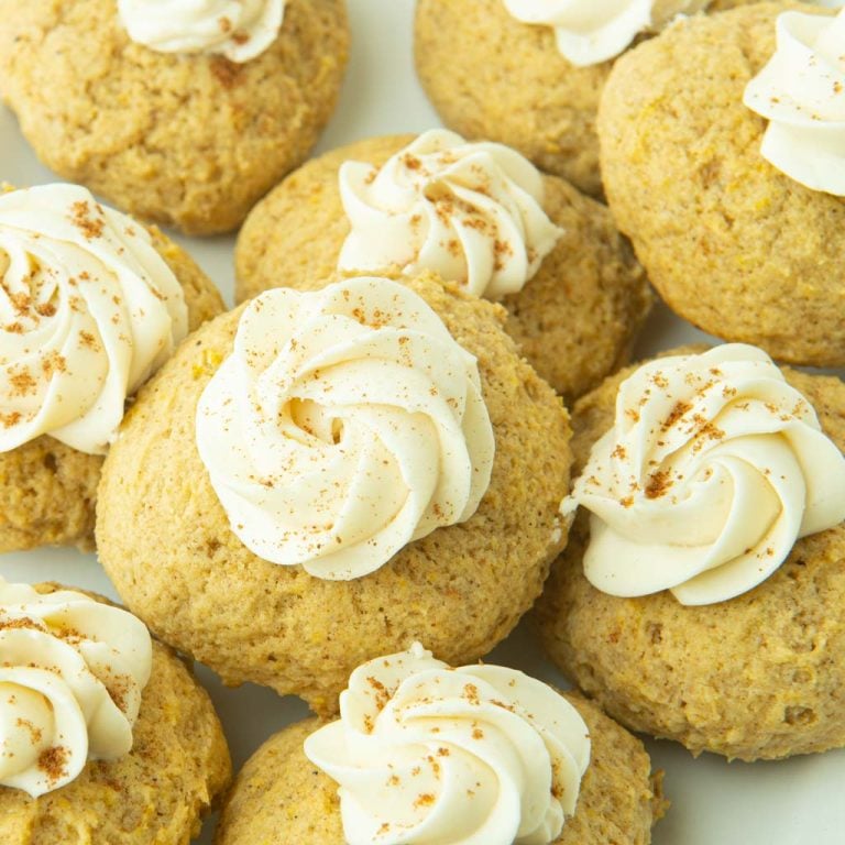closeup of soft pumpkin cookies with cream cheese icing