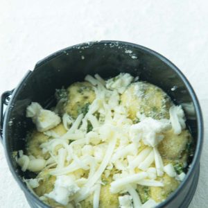 small springform with pesto monkey bread before baking