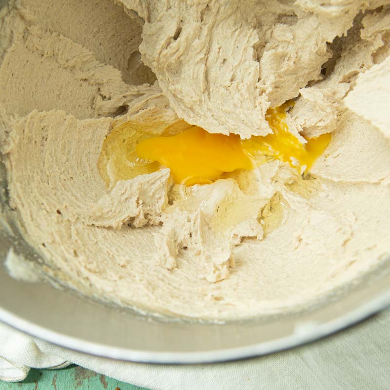 adding eggs to creamed butter and sugar