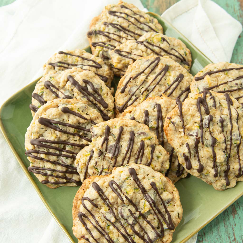 zucchini cookies drizzled with chocolate on plate
