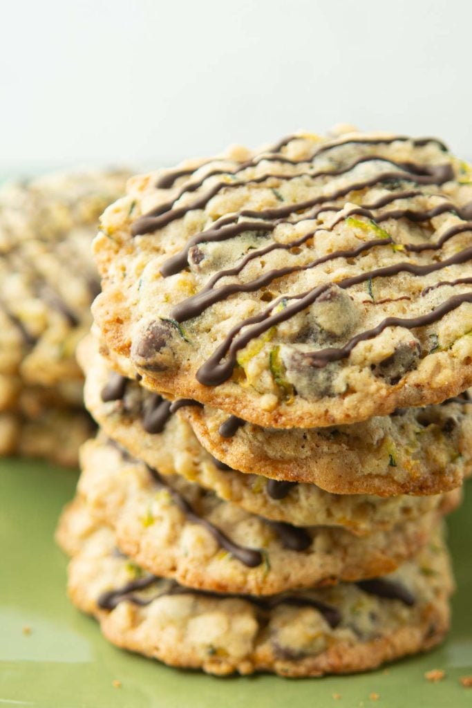 stack of zucchini cookies drizzled with chocolate