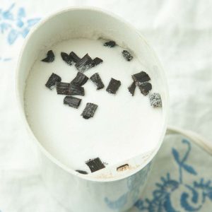 sugar and vanilla bean pieces in coffee grinder