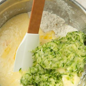 folding zucchini into muffin batter
