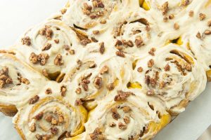 frosted pumpkin cinnamon rolls