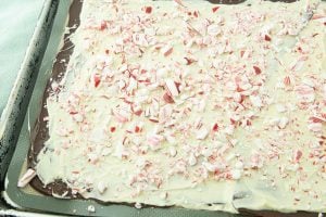 sprinkling candy canes on white chocolate