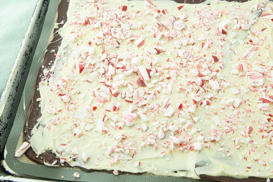 sprinkling candy canes on white chocolate