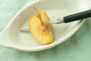 knife through cooked apple