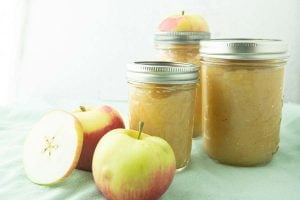 applesauce in canning jars with apples