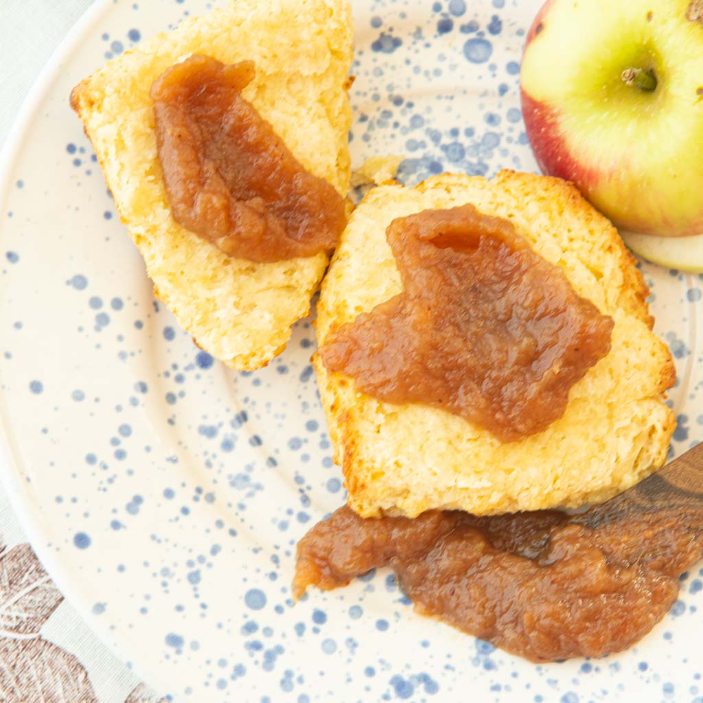 apple butter on sliced biscuits with apple piece