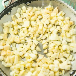 diced apples coated in butter in skillet
