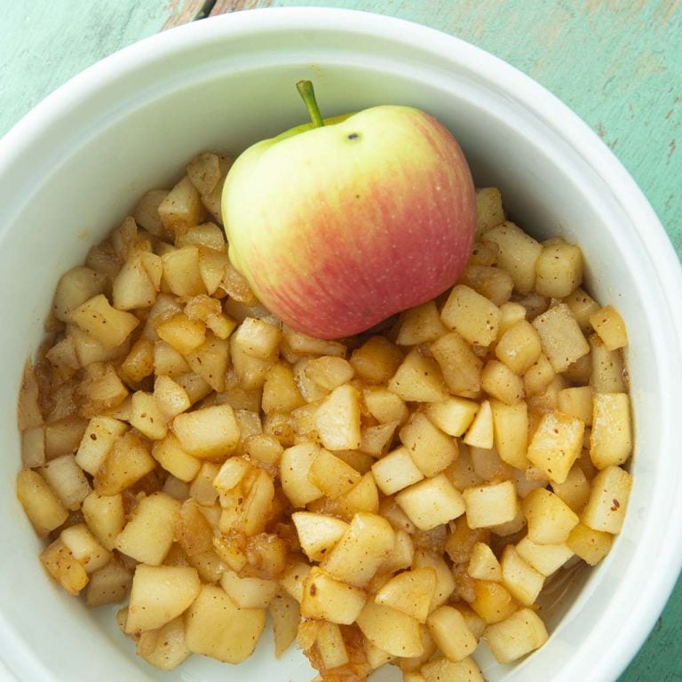 homemade apple pie filling in dish with apple