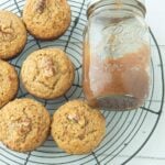 apple butter muffins and jar of apple butter on wire rack