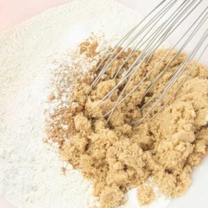 whisking dry ingredients together in bowl