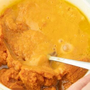 mixing pumpkin puree, eggs and olive oil together