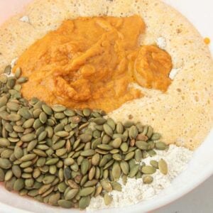 pumpkin seeds, pumpkin puree and hard cider added to flour