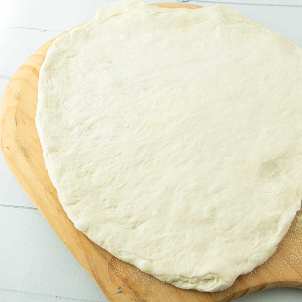 pizza dough on pizza peel