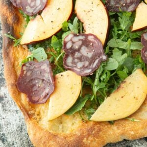 arugula, nectarine and salami pizza