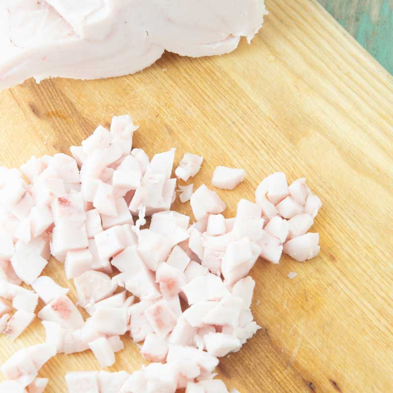 diced pork fat on cutting board