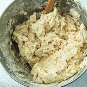folding apples into apple cake batter