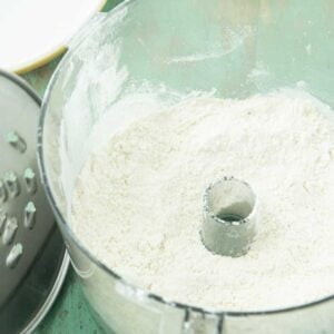 dry ingredients for biscuits in bottom of food processor