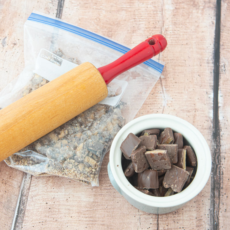smashed Heath bars with rolling pin and Heath bar pieces