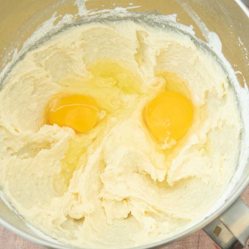 adding eggs to butter mixture