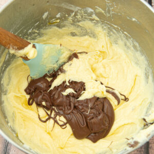 folding melted chocolate into batter