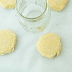 pressing dough with glass