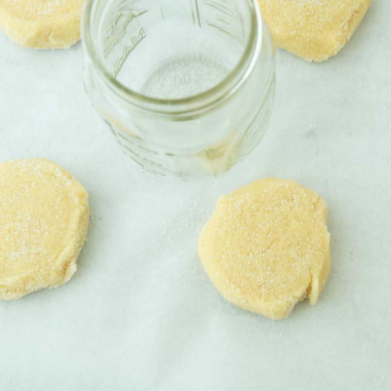 pressing dough with glass
