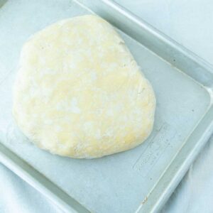 cream cheese pastry disk on sheet tray