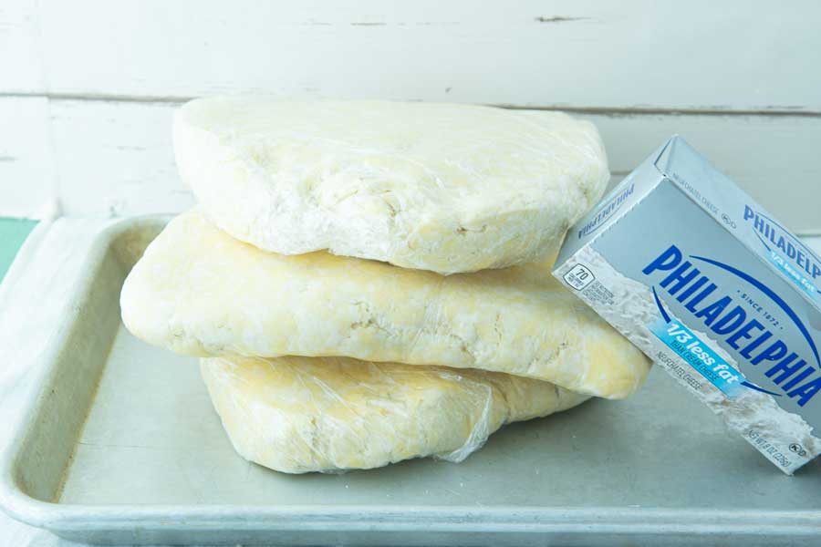 cream cheese pastry disks on sheet tray