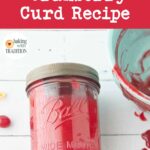 cranberry curd in jar next to candied orange peel and whole cranberries