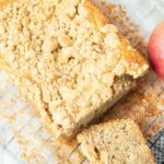 applesauce bread loaf with streusel and whole apple
