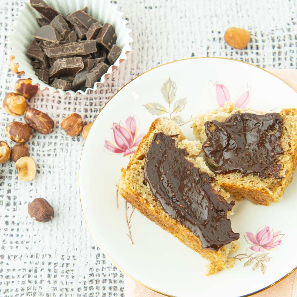 hazelnuts, chopped chocolate and homemade nutella spread on bread