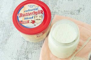 dried buttermilk powder with jar of buttermilk