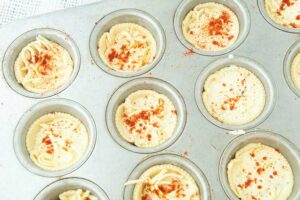 unbaked quiches in muffin pan