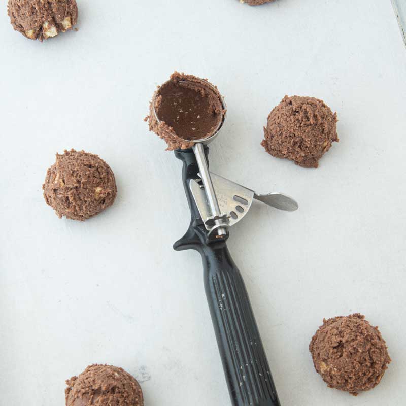 cookie scoop with balls of Twix cookie dough