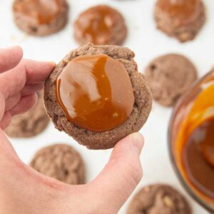 caramel center on a twix cookie held by hand
