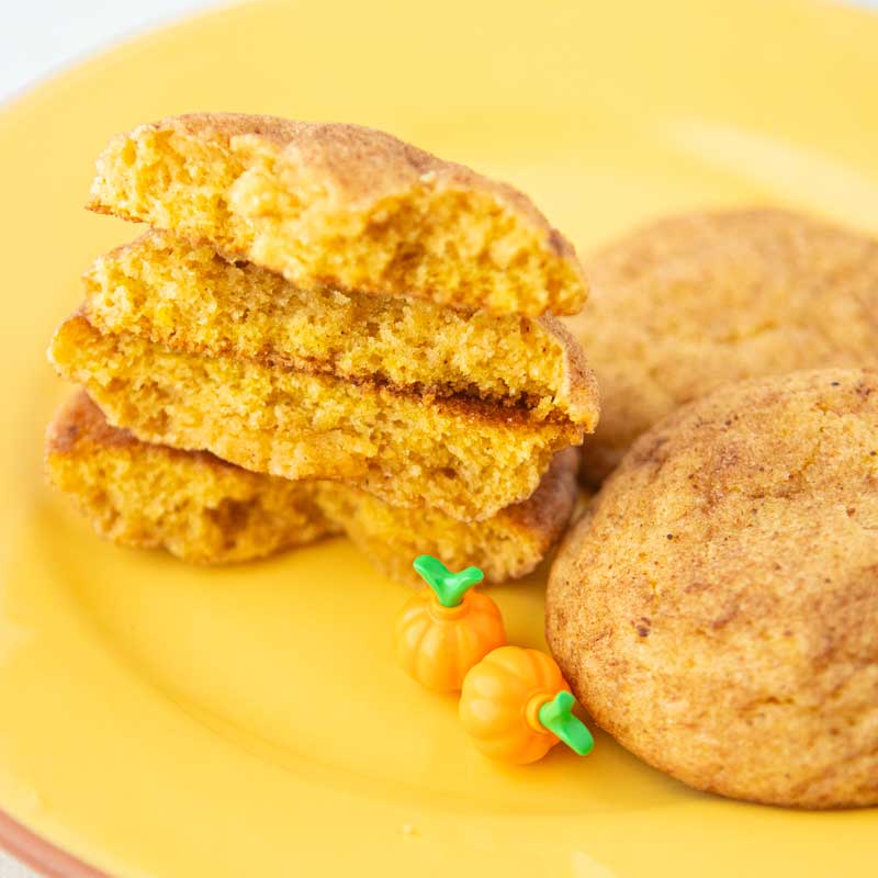 cross section of pumpkin snickerdoodles with Lego pumpkins on plate
