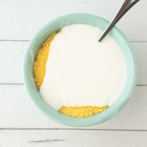 adding buttermilk to cornbread mix