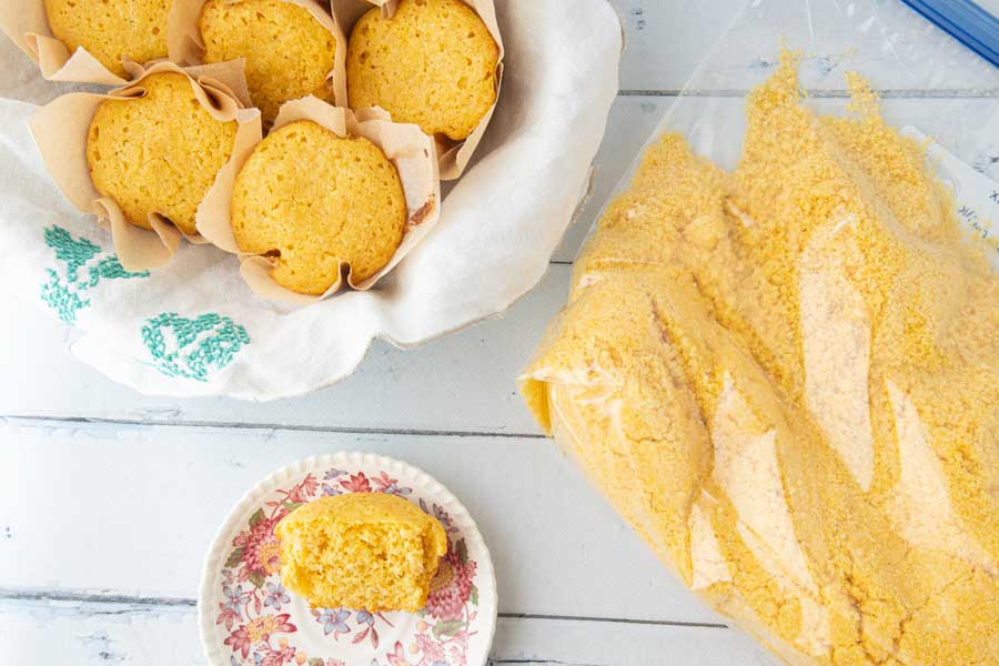 cornbread mix in plastic bag, cornbread muffins in bowl and on plate