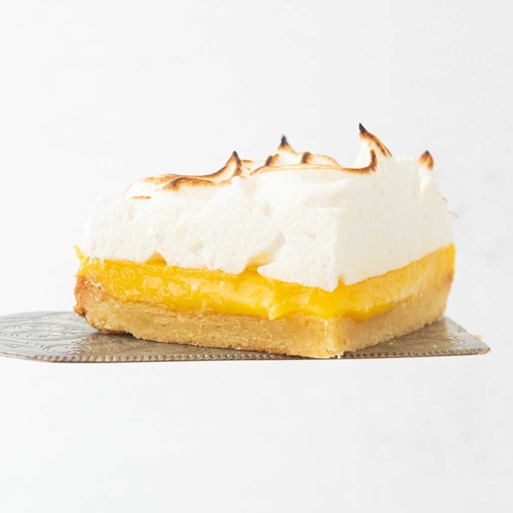 lemon meringue bar on pie server