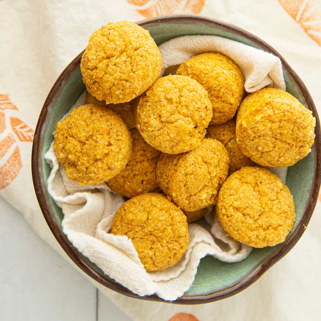 vegan pumpkin cornbread muffins in bowl