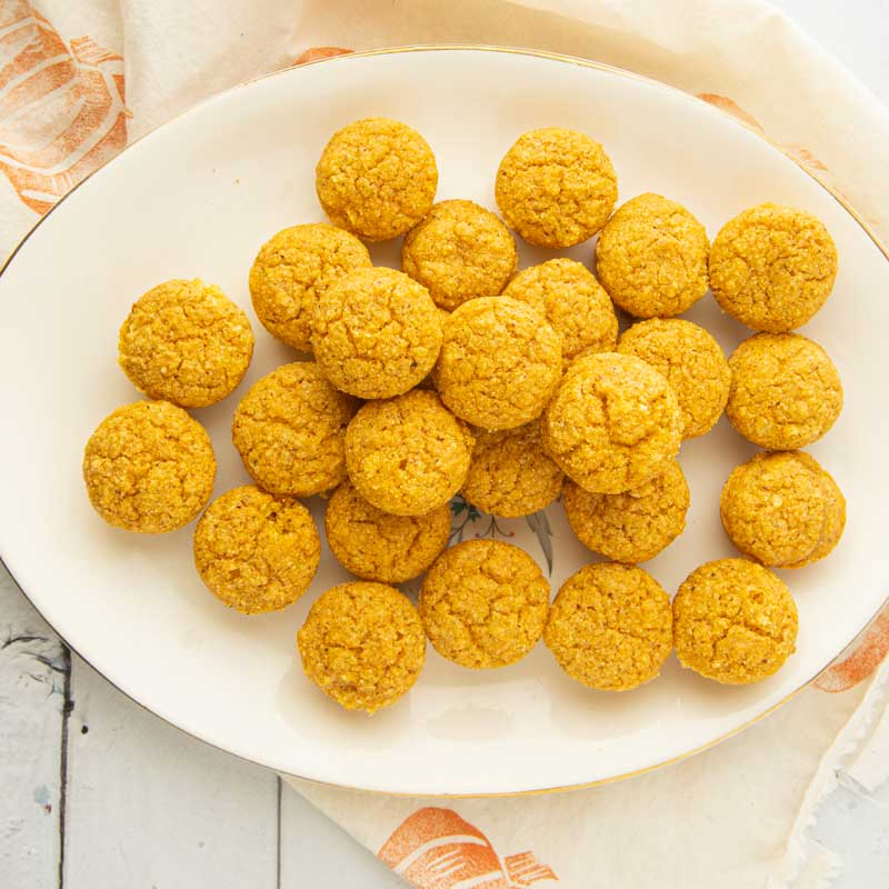 pumpkin vegan cornbread muffins on plate